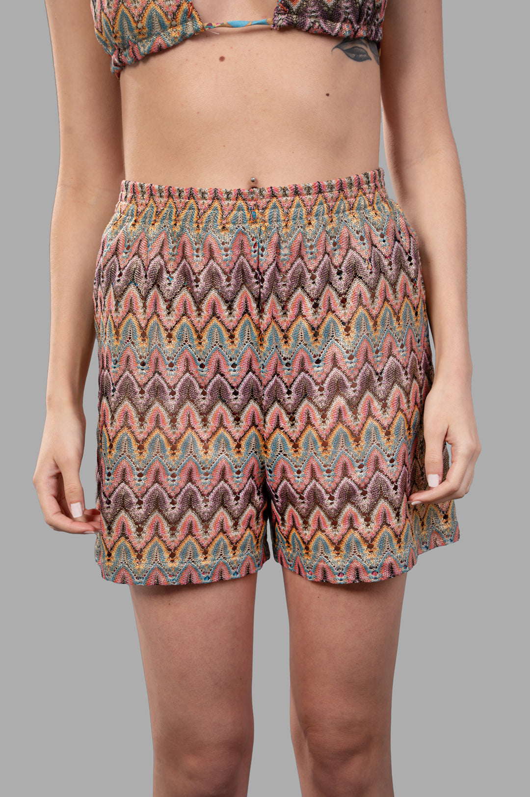 Anjuna Zig Zag Knit Shorts in multicolor, featuring a relaxed fit and textured zigzag pattern, modeled for a stylish look.