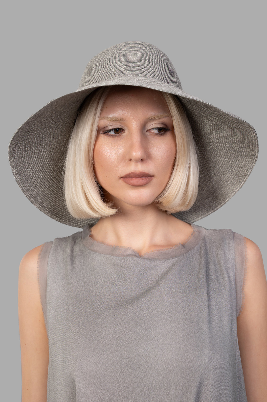 Kijima Takayuki Mushroom Hat displayed on a model, showcasing its elegant grey design and handcrafted texture.
