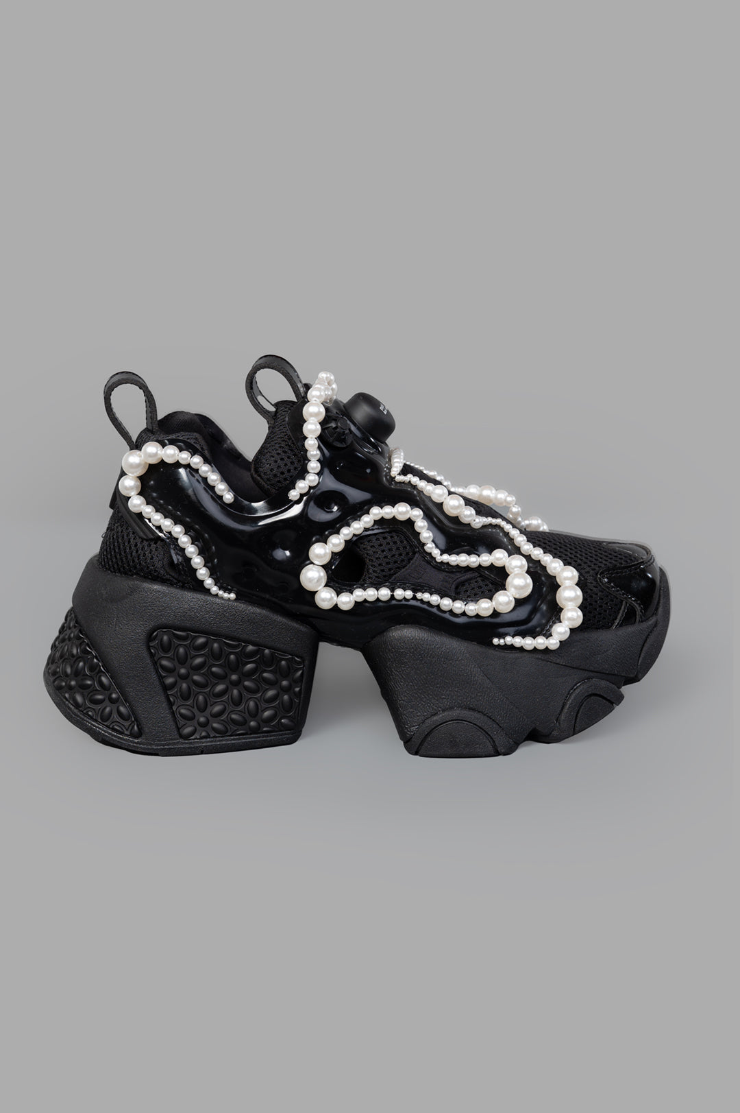 Noir Kei Ninomiya x Reebok Pearl-embellished Sneakers; side view with black upper and contrasting pearl detailing.