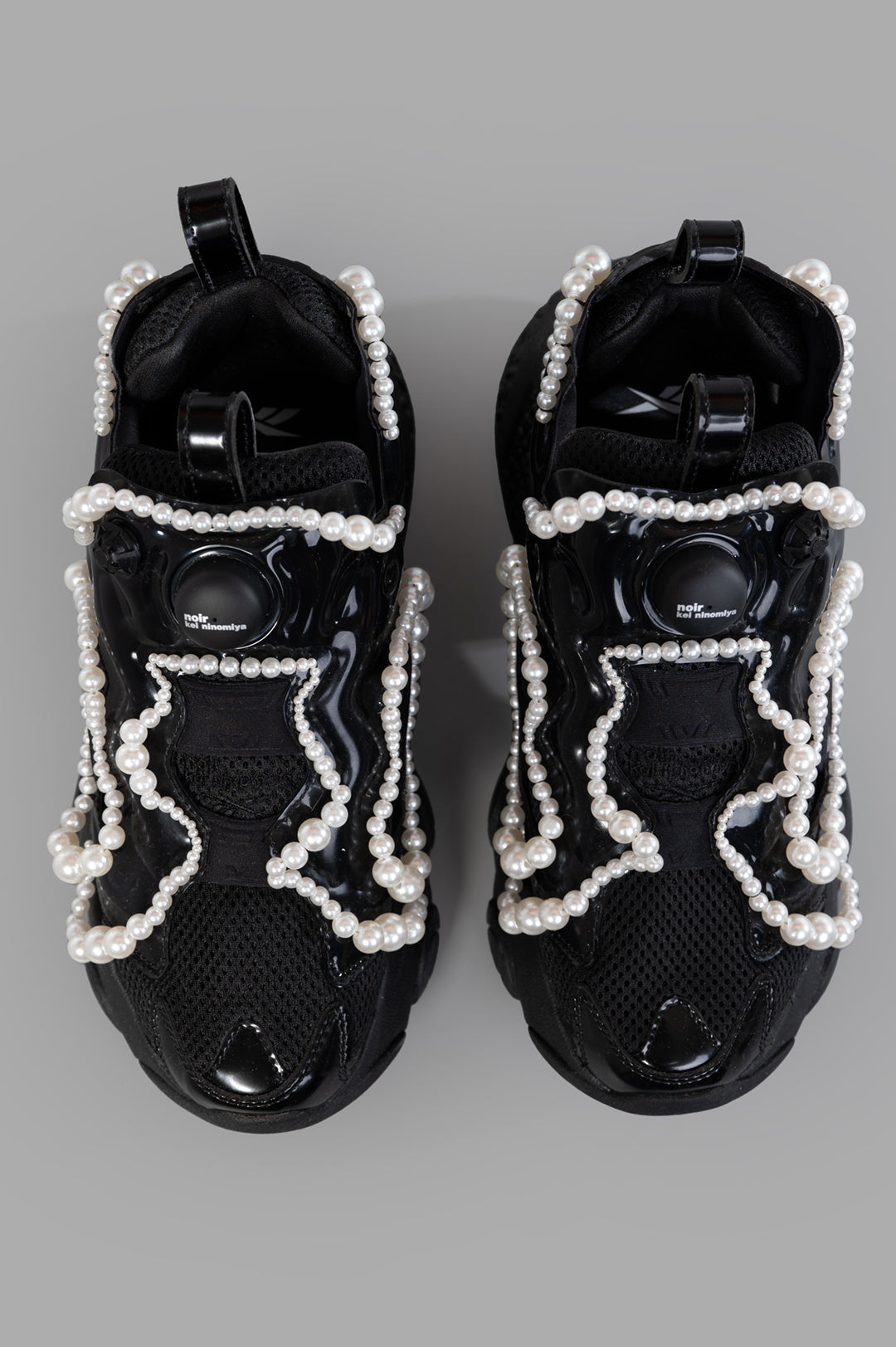 Noir Kei Ninomiya x Reebok Pearl-embellished Sneakers in black, featuring intricate pearl detailing and chunky rubber soles.