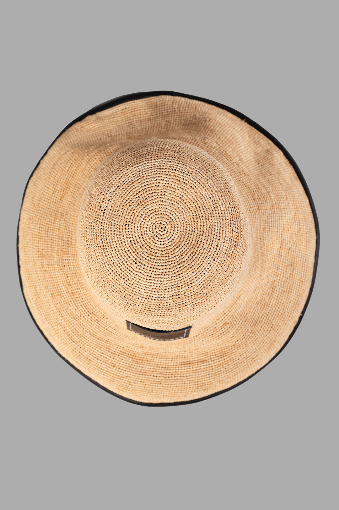 Kijima Takayuki Straw Mushroom Hat featuring a detailed top view, showcasing the natural raffia texture and black edges.