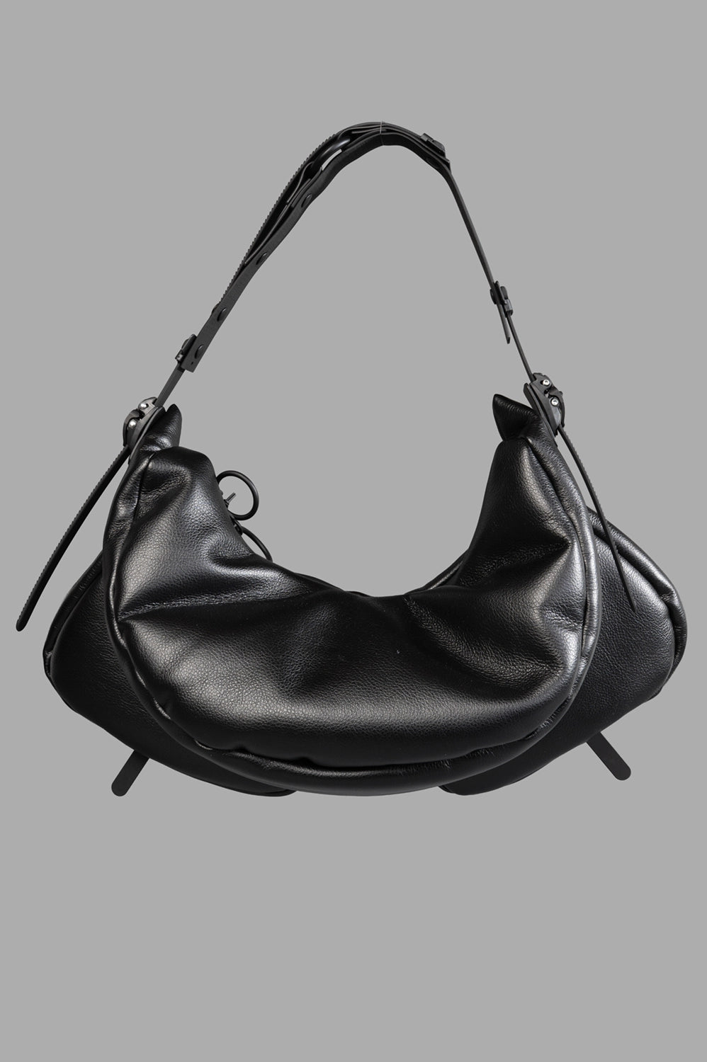 Back close-up with smooth padded panel, adjustable handle and side strap hardware.