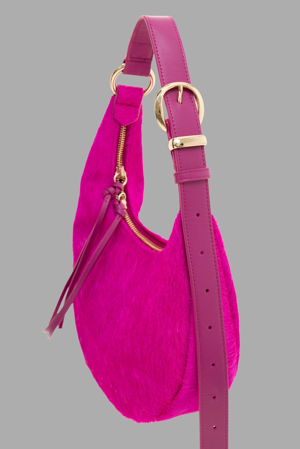 Des Phemmes women's small hobo bag in Framboise, side view, adjustable strap with gold buckle and leather zip pulls.