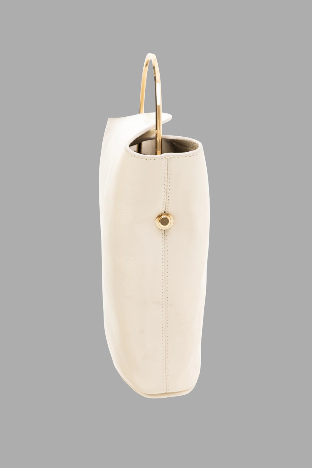 Gentry Portofino women small top-handle bag in Stucco, side view, gold grommet hardware, slim profile