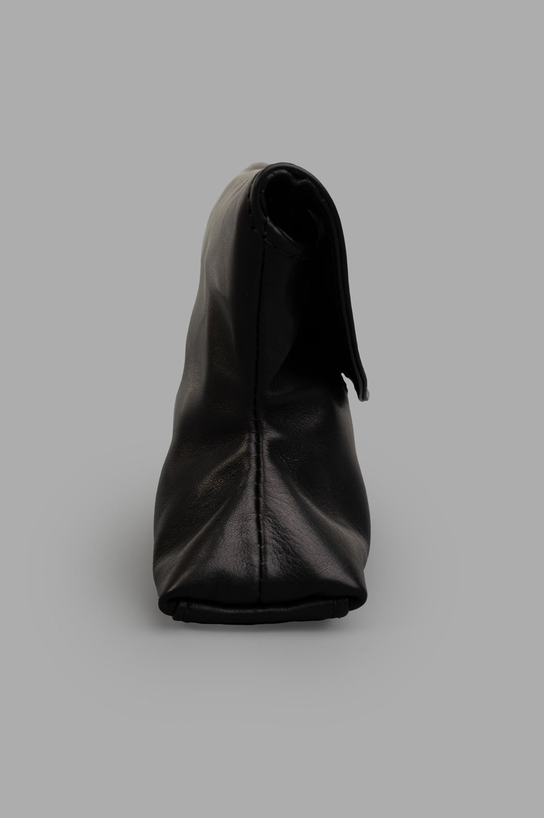Marsèll Small Leather Clutch shown from the front, featuring soft black leather with a unique, refined shape.