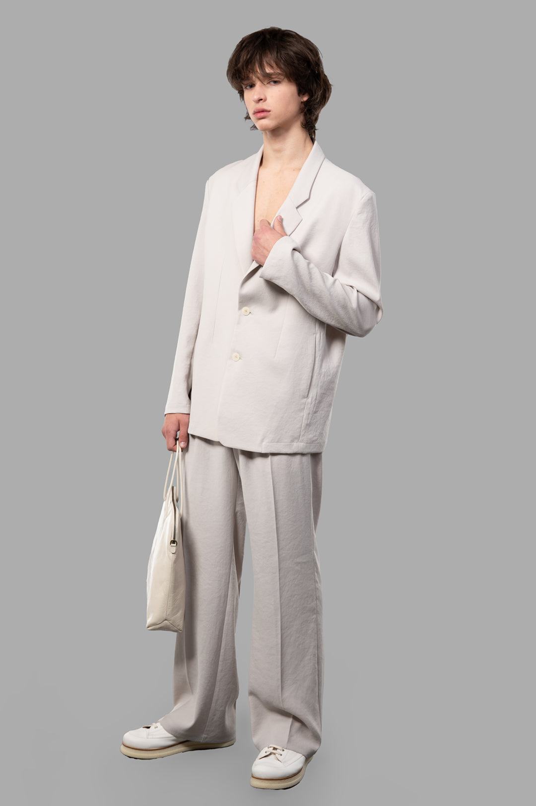 Vein Single-breasted Jacket in beige polyester, modeled front view; features slim collars and a sleek design.