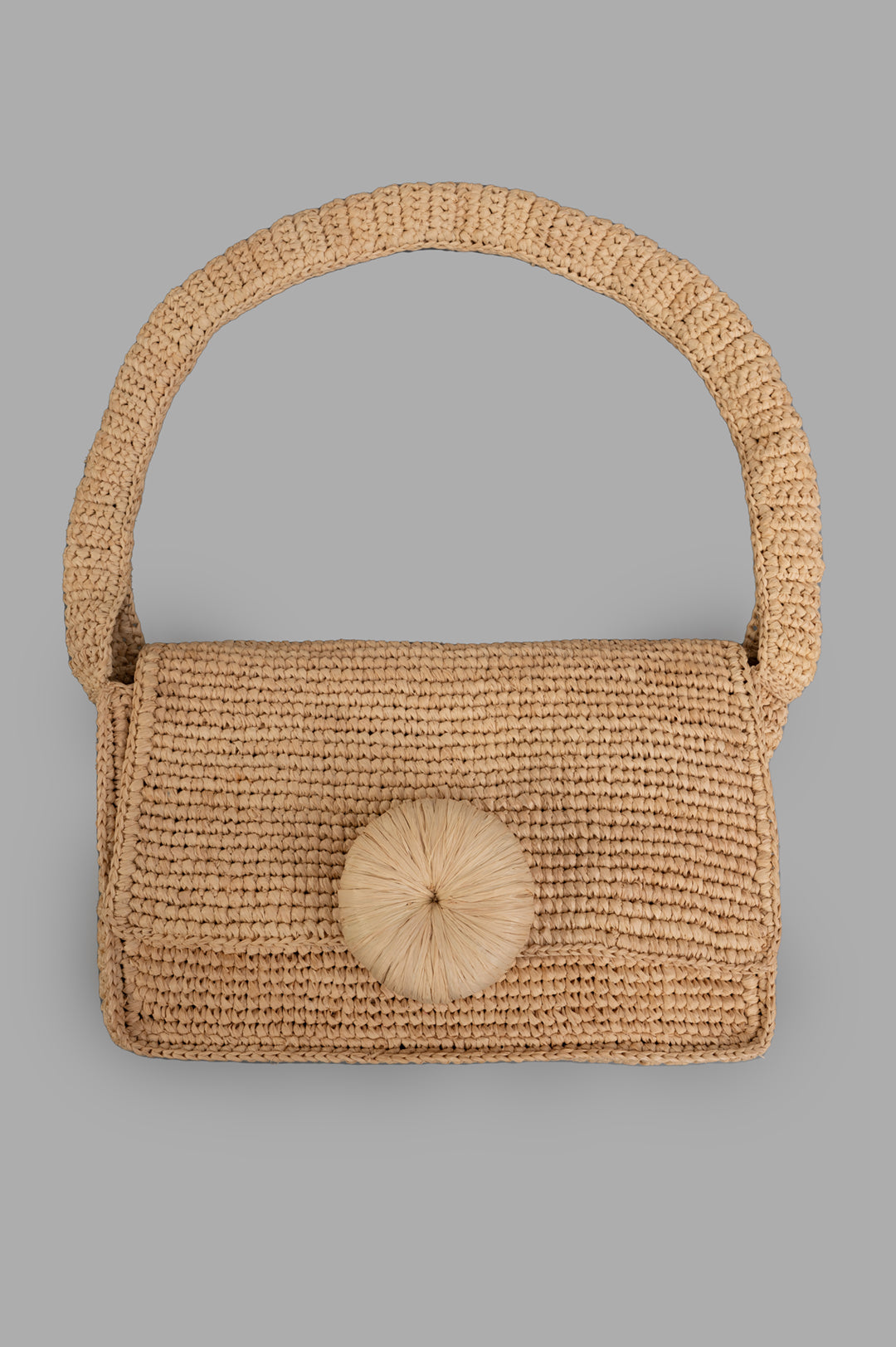 By Malene Birger Miro Shoulder Bag in natural raffia with a floral appliqué button, front view, beige color.