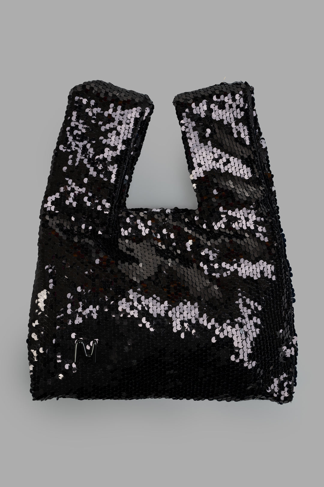 MSGM Black Paillettes Bag front view with sequin detail and logo on gray background. Image 1.