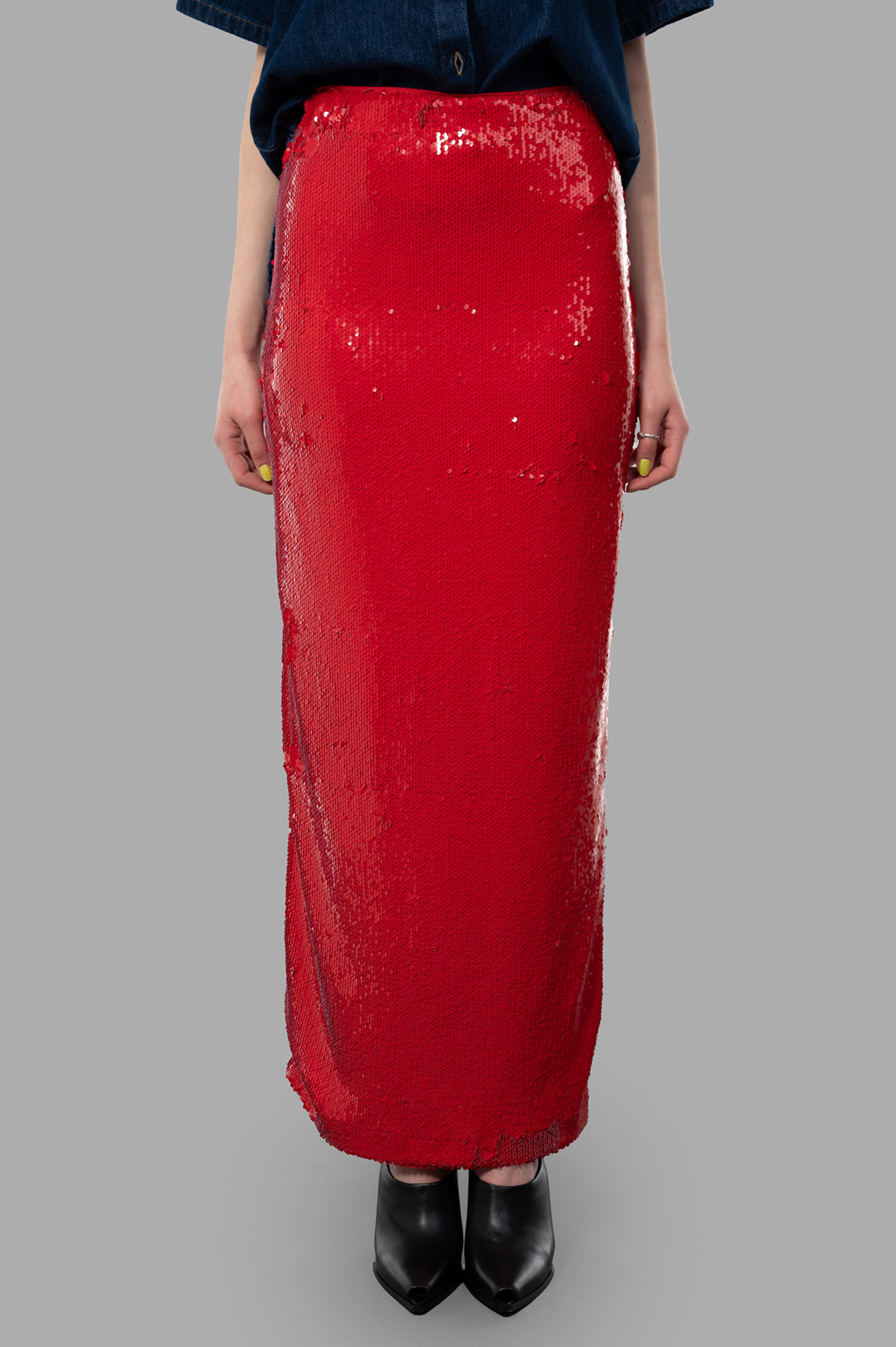 MSGM Red Sequin Skirt showcased on a model, featuring a sleek, fitted silhouette with a dazzling sequin finish.