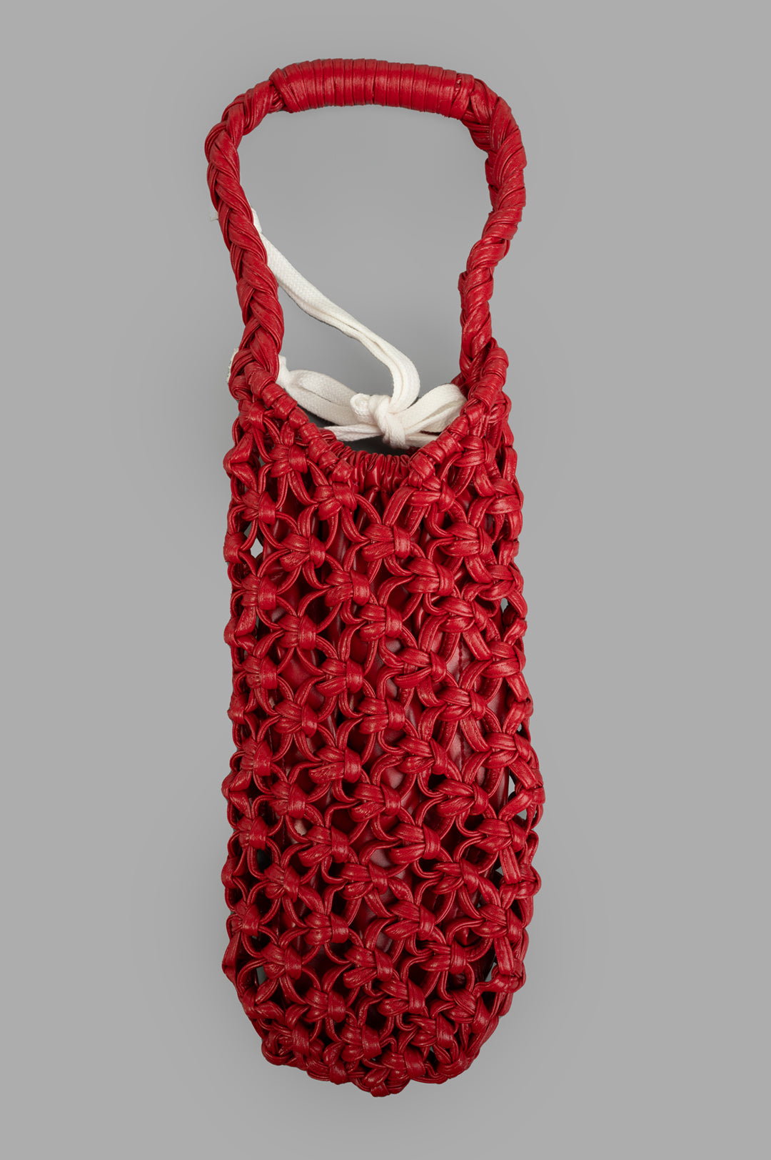 Comme des Garçons Braided Bag, front view, showcasing intricate red weave and white inner detail. Image #1.