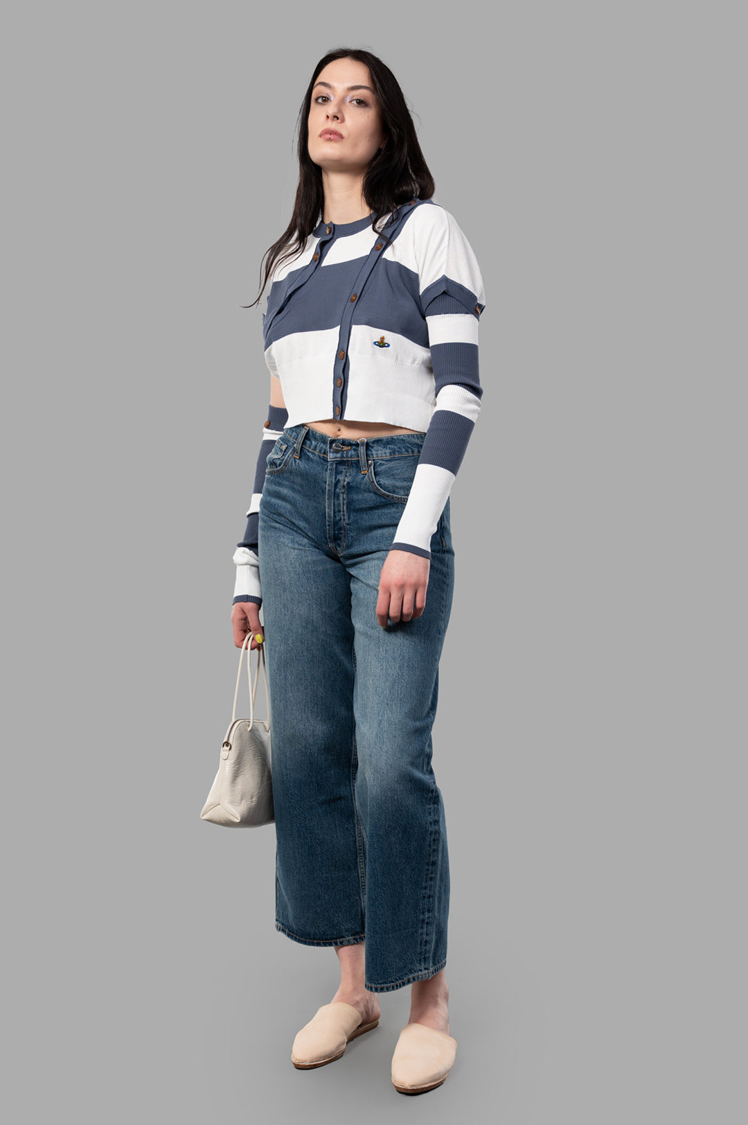 Vivienne Westwood Olivia Cardigan on model; blue/white stripes, dual-button front, orb embroidery, casual style.