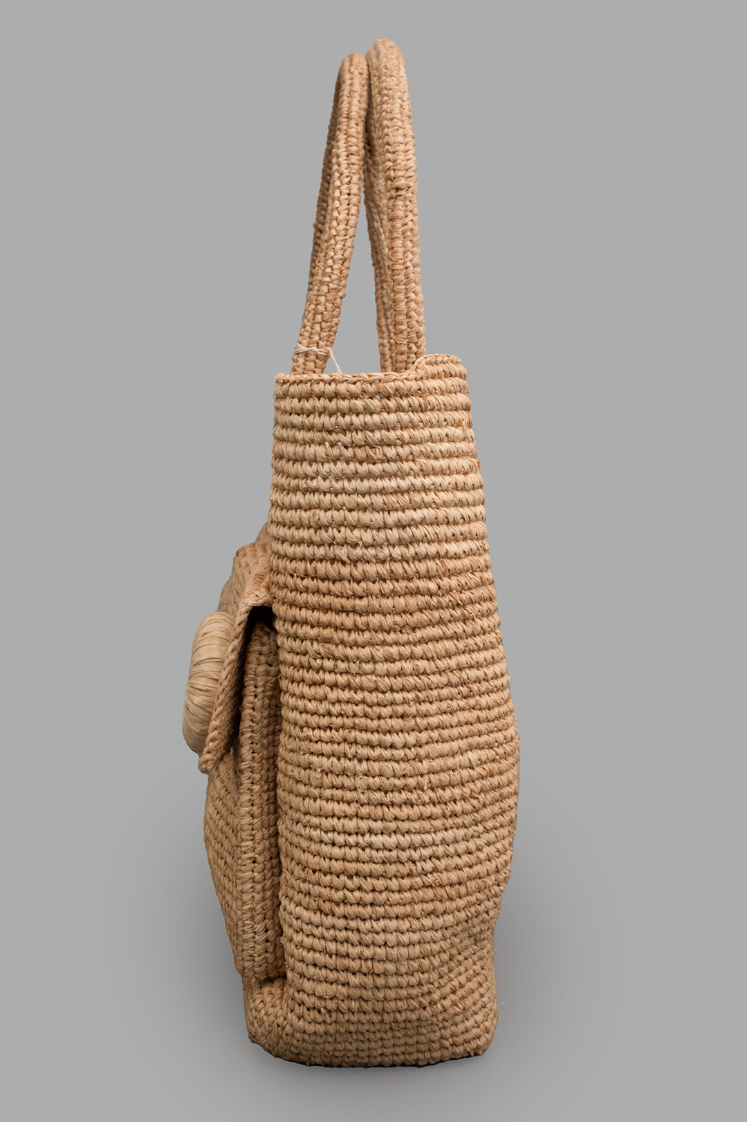By Malene Birger Miras Tote Bag side view showcasing natural raffia, spacious design, and floral appliqué detail.