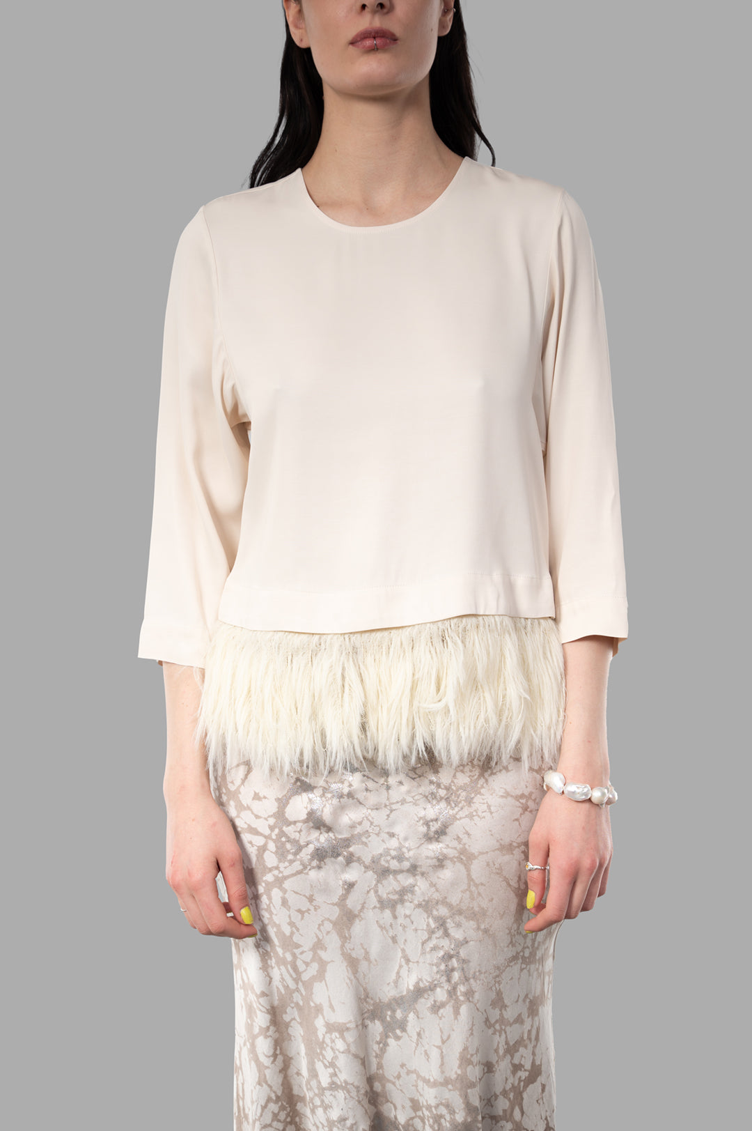 By Malene Birger. Scarletts Blouse features a round neckline, cropped sleeves, and detachable feather trim at the hem.