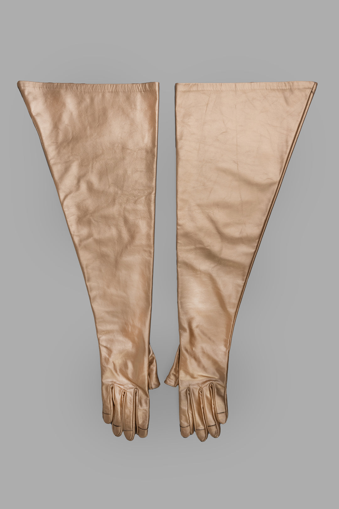 Rick Owens Hollywood Runway Gauntlets in calf leather with gold metallic finish, showing full-length front view.