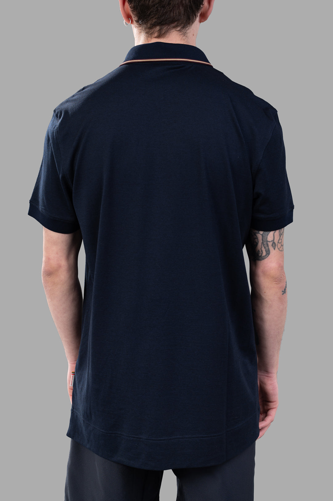 Orlebar Brown Dominic Polo Shirt in navy, featuring contrast tipping, shown from the back on a model.
