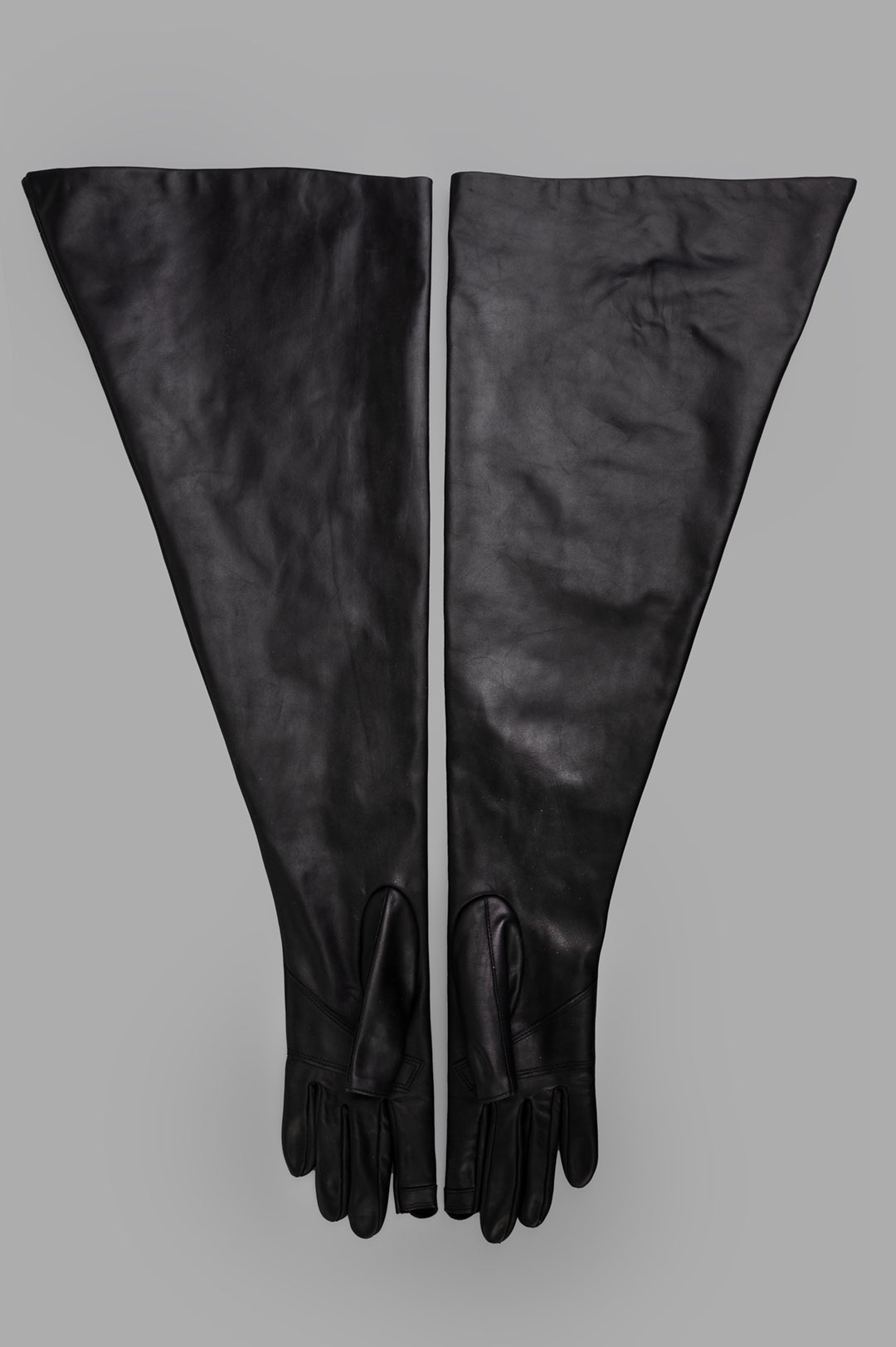 Rick Owens Hollywood Runway Gauntlets in Black, above-elbow length, smooth calf leather, showing cut-out thumb and index.