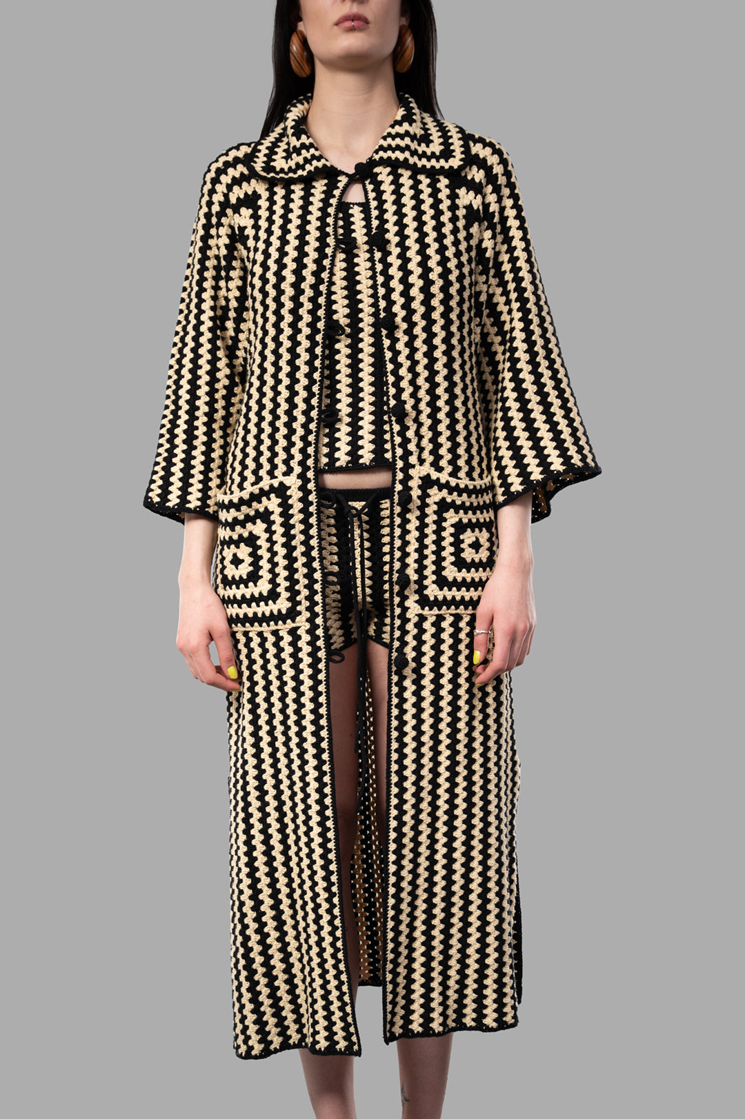 By Malene Birger Dina Organic Cotton Coat, chunky crochet design, beige and black, featuring front pockets and button closure.