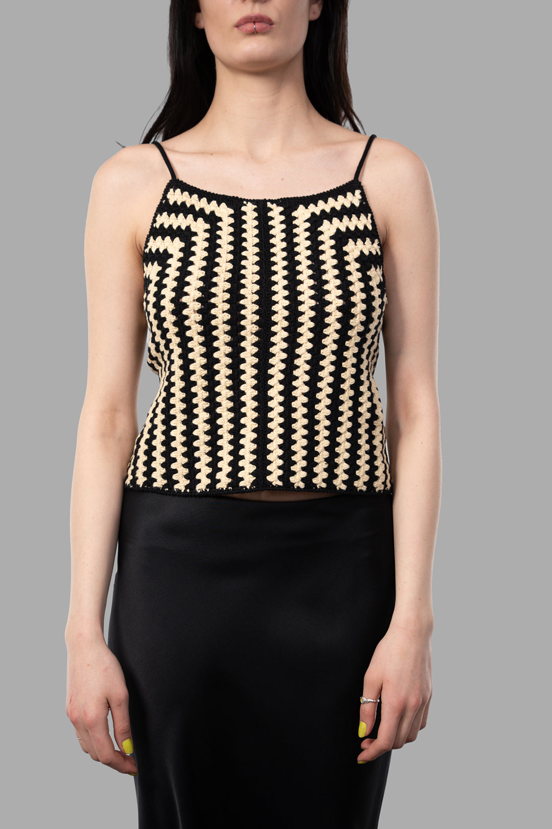 By Malene Birger Doria Organic Cotton Top in beige and black, featuring a crocheted design and adjustable straps on model.