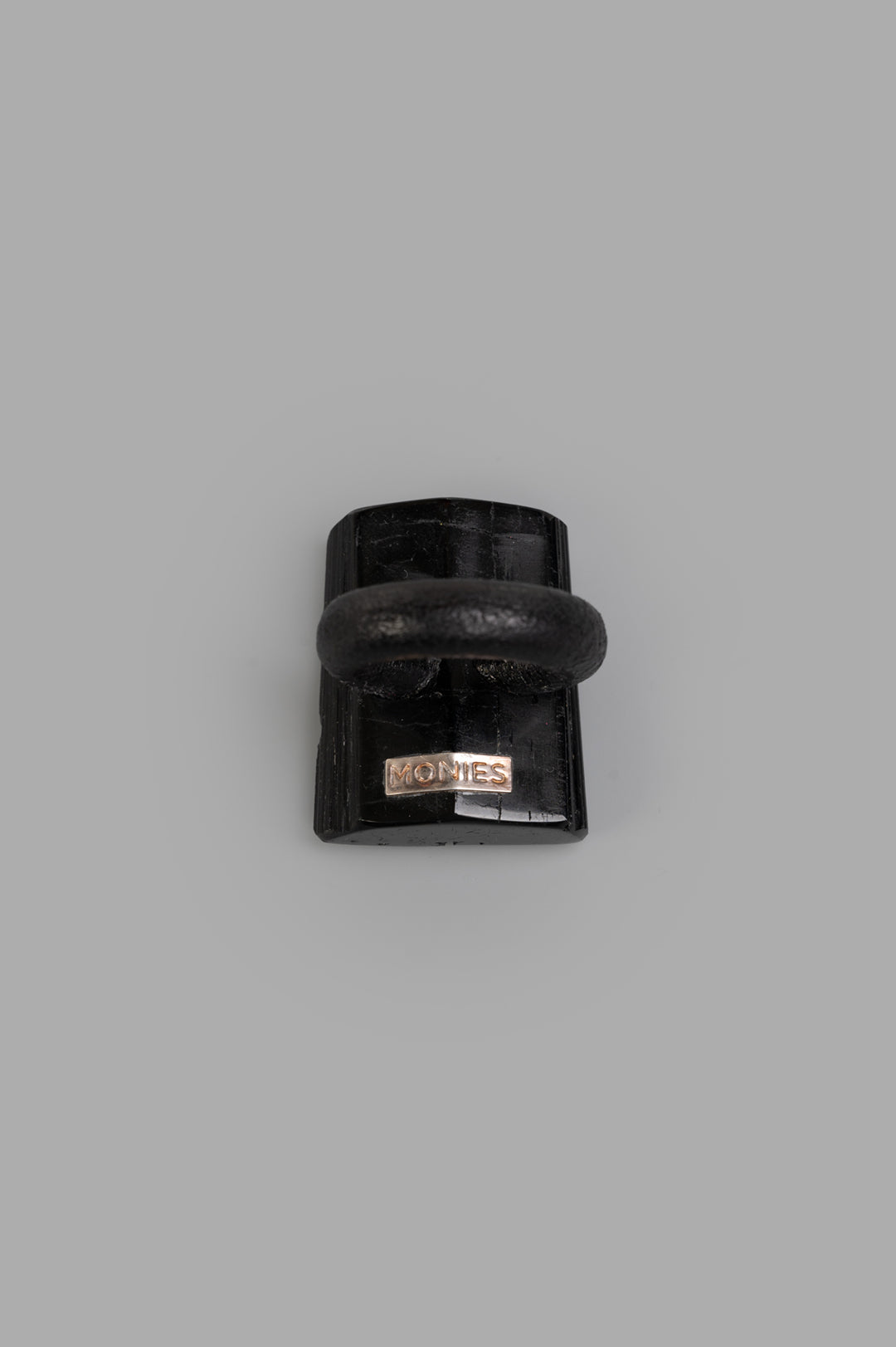 Monies Textured Ring in black turmaline, showcasing a close-up view of its unique shape and bold design.