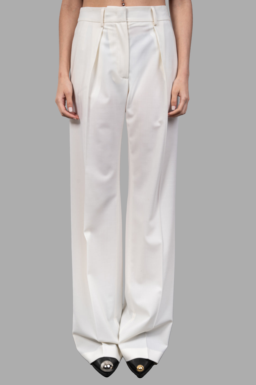 MSGM Wide-leg Trousers in ecru, tailored with front pleats, showcasing a refined silhouette and comfortable fit on model.