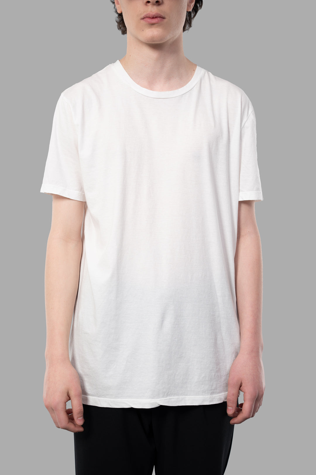 MD 75 Cotton T-shirt in white, showcasing a soft texture and relaxed fit on-model with minimalist design.