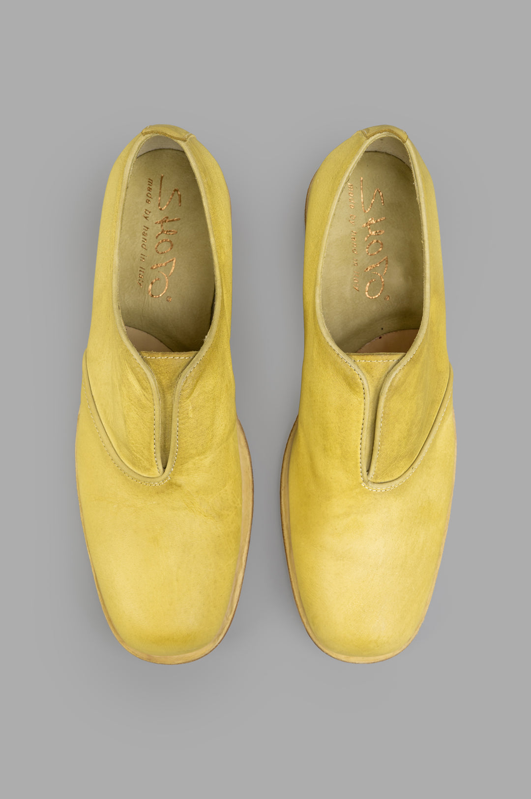 Shoto. Top view of handmade Lime Leather Shoes in vibrant yellow, showcasing unique texture and artisanal craftsmanship.