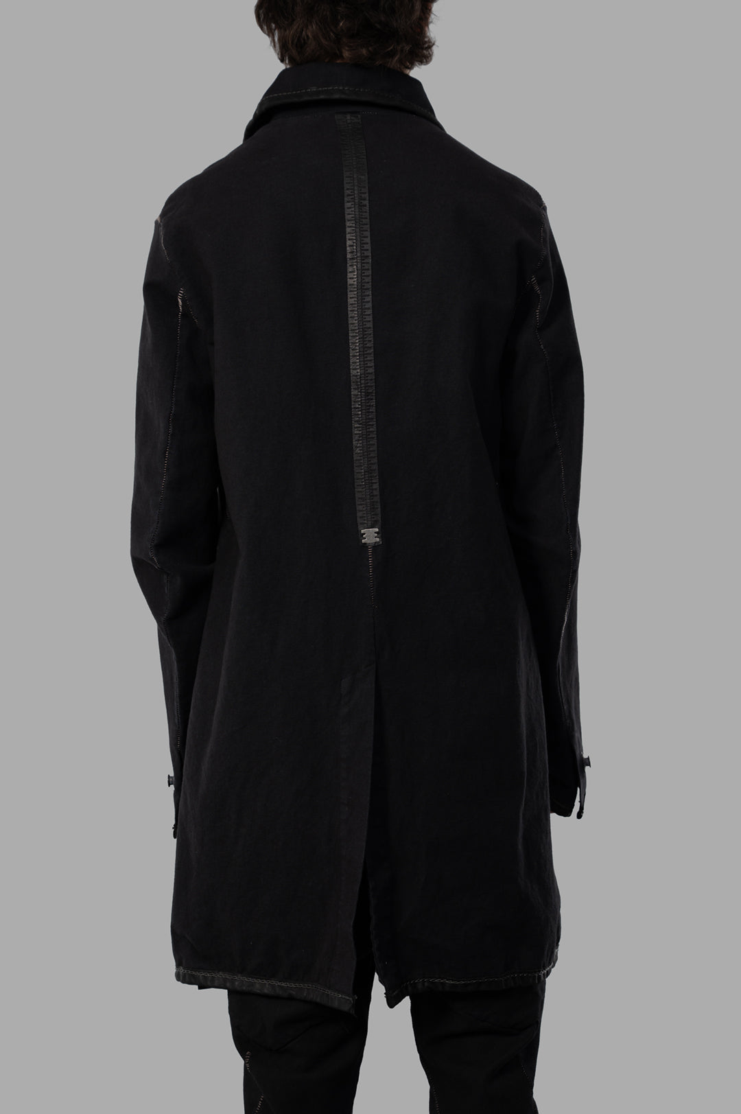 Isaac Sellam Zip-up Parka, showcasing the back design with unique zipper detailing and tailored silhouette in black.