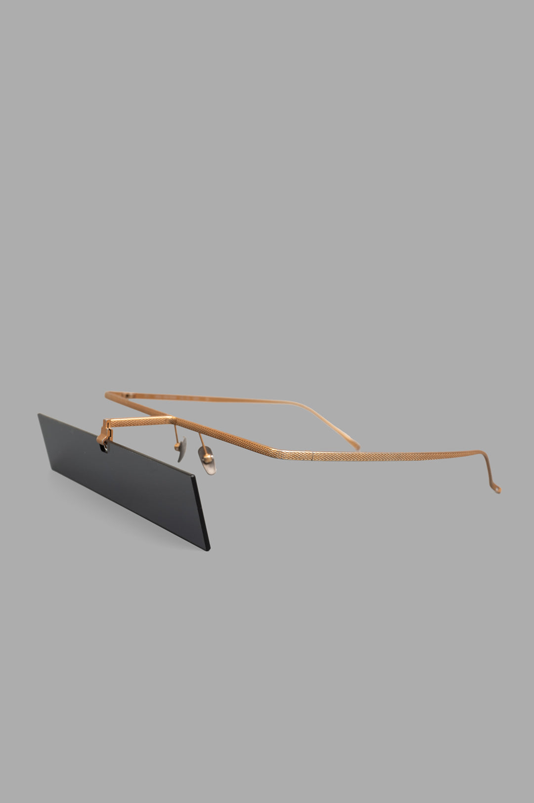 Uma Wang x Rigards Rectangular Glasses, side view. Gold titanium frame with unique design.