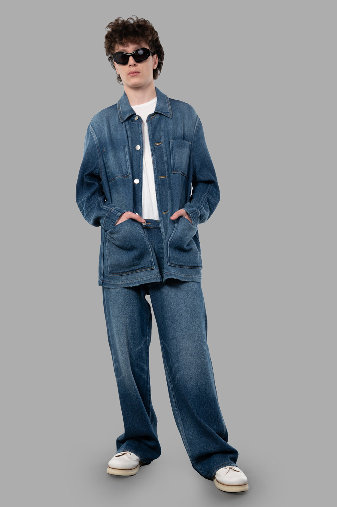 Vein Faded Denim Jacket on-model, relaxed-fit style with patch pockets, blue cotton fabric, full front view.