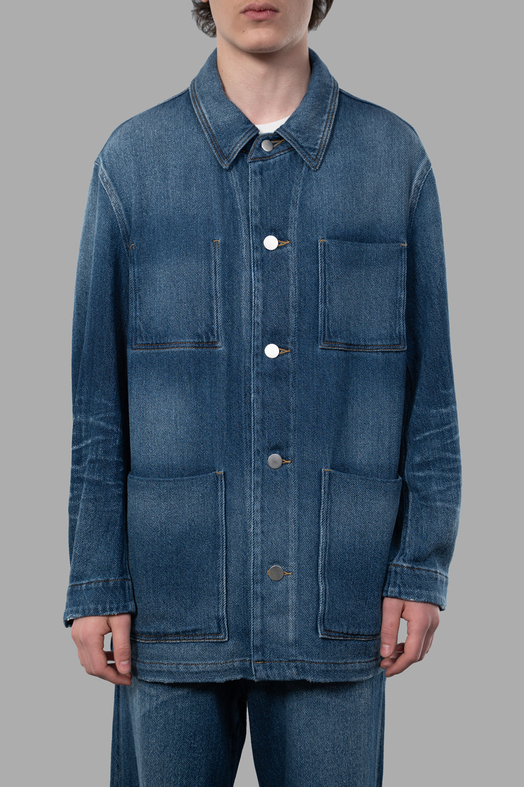 Vein Faded Denim Jacket in blue, showcasing a relaxed fit and four patch pockets, perfect for an adventurous look.