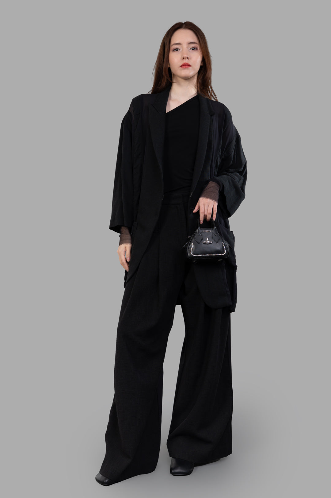 Giovanni Cavagna Paneled Blazer, black, front view on model, 70% cotton, 30% silk, showcasing innovative design.