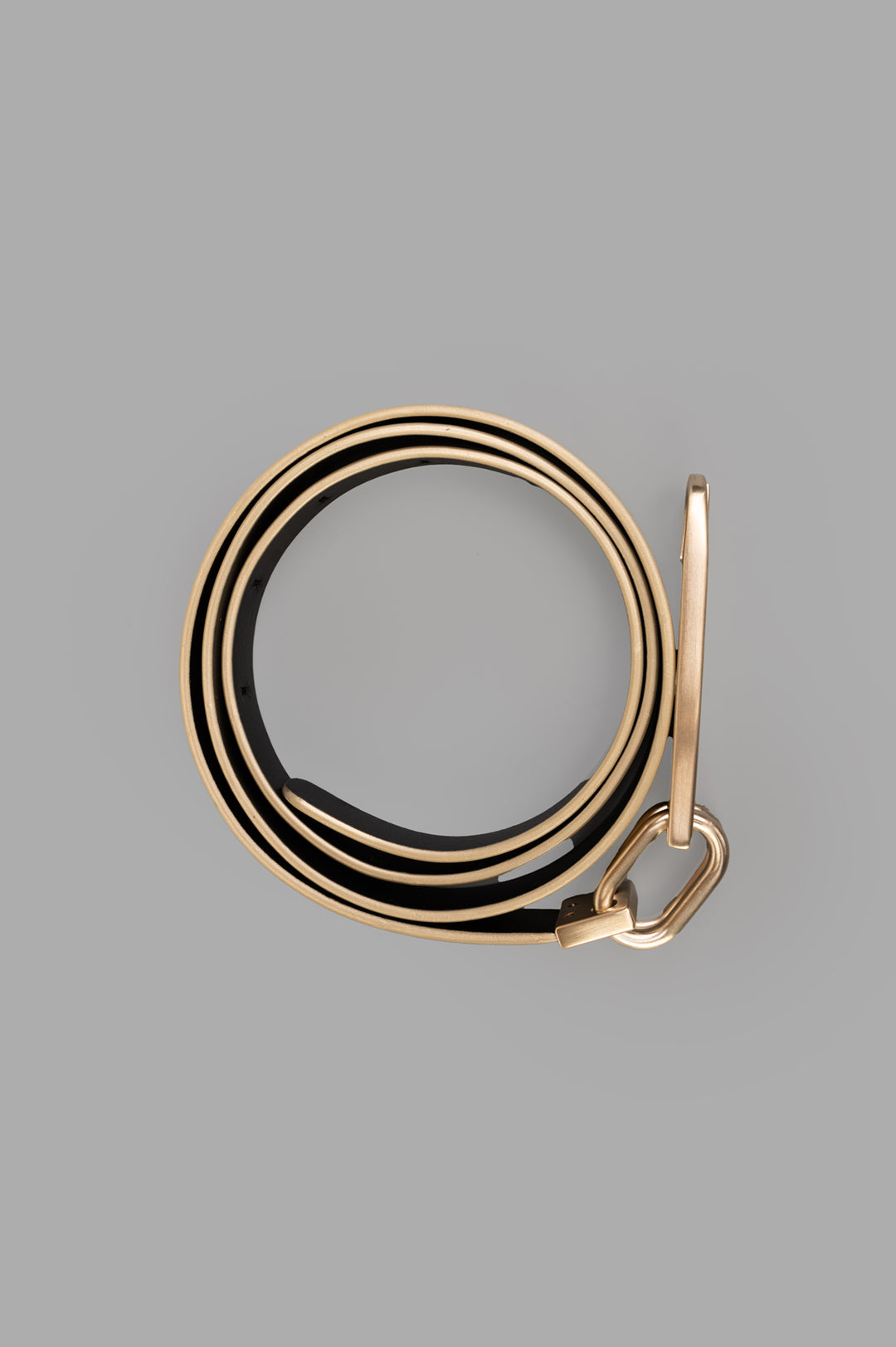 Rick Owens Snap Hook Belt showcased showing a close-up of the gold calf leather and stylish snap hook detail.
