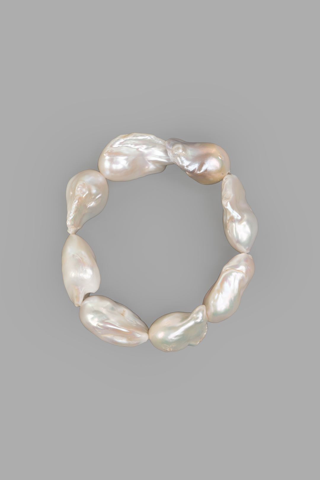 Monies Baroque Pearl Bracelet, front view displaying irregular shaped pearls on a gray background.