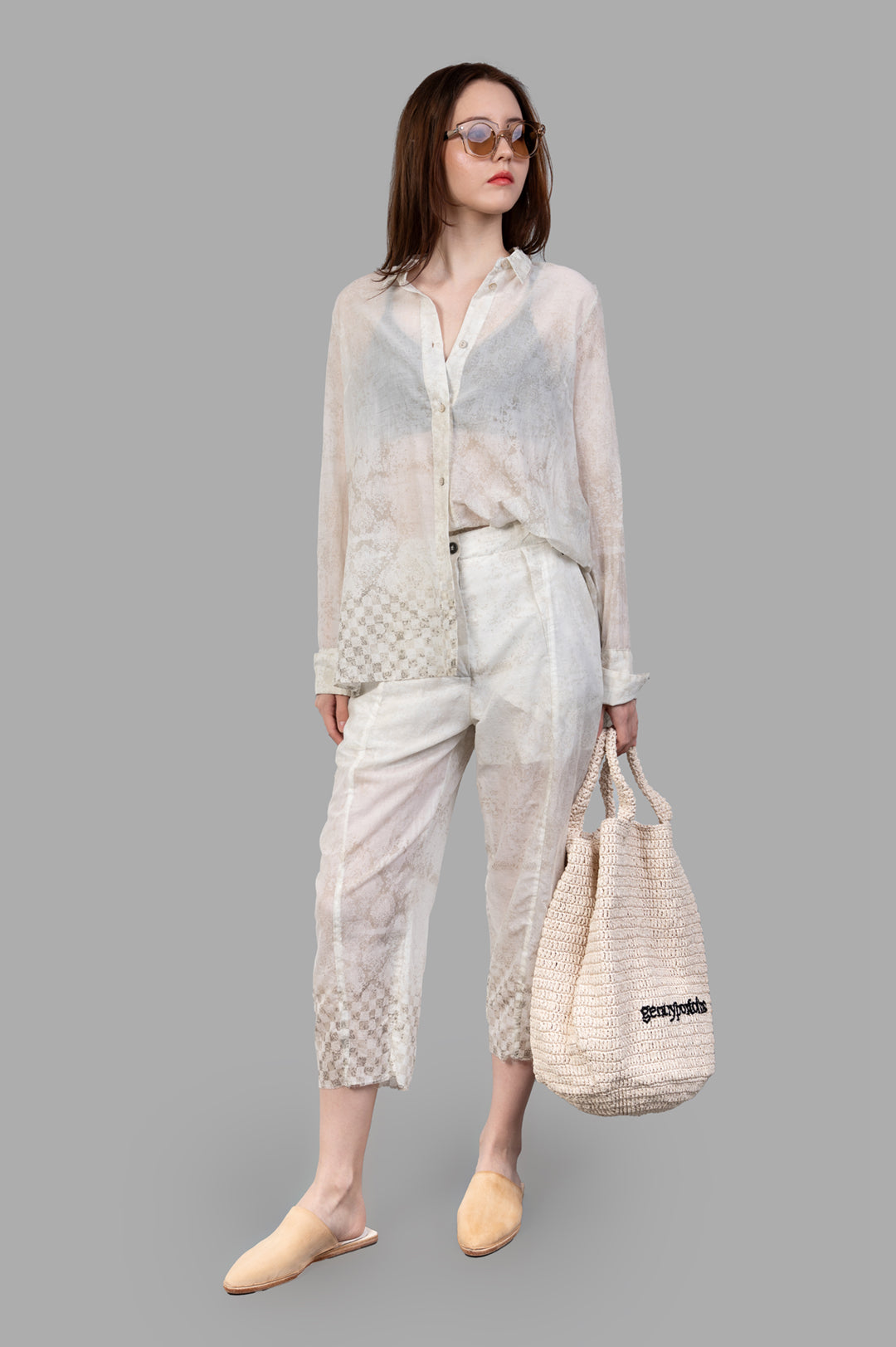 Masnada Plaster Shirt in ecru, translucent loose fit, subtly detailed. Front view on model with woven accessories, Italy.