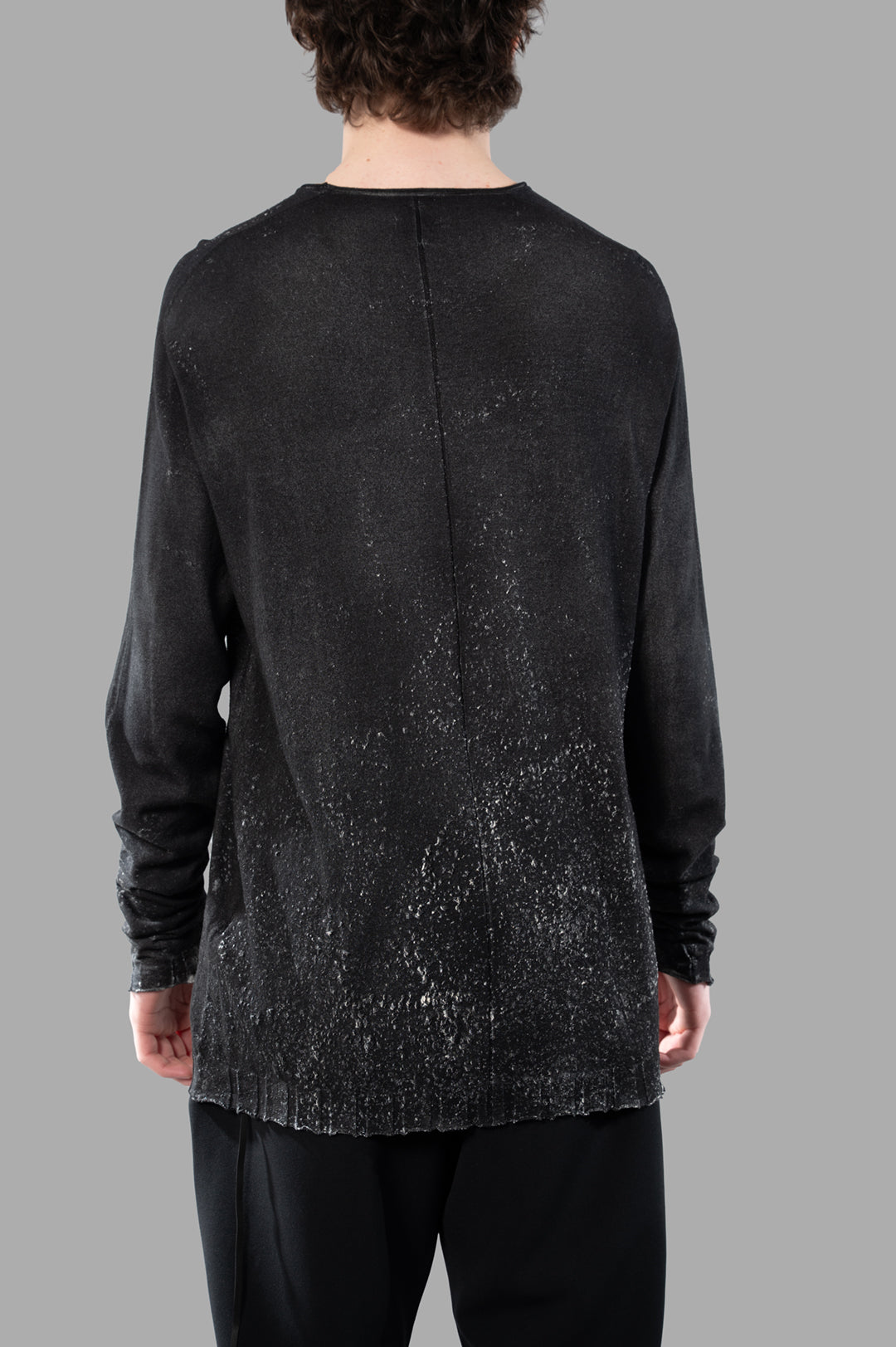 MD 75 Long-sleeved Airbrushed Sweater, back view showcasing the unique texture and raw detailing in soft black cotton.