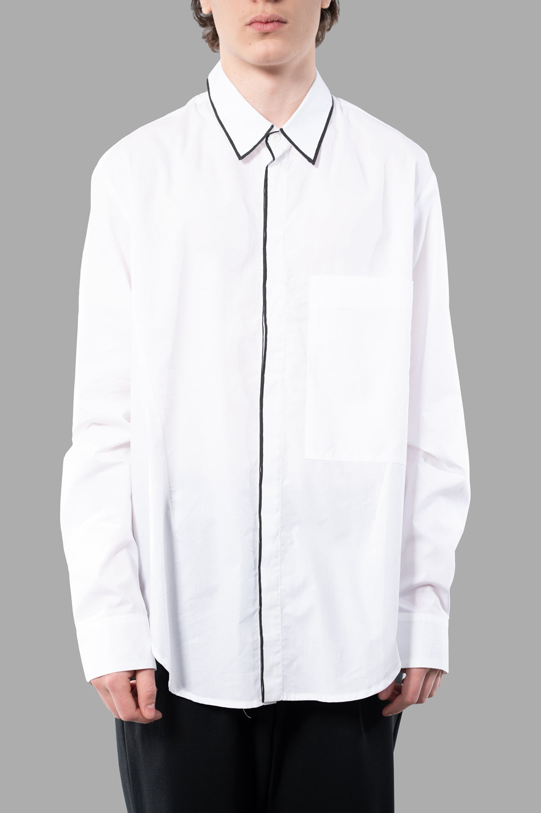 Giovanni Cavagna Contrast-line Shirt in relaxed-fit, featuring bold black contrasts, modeled on a gray background.