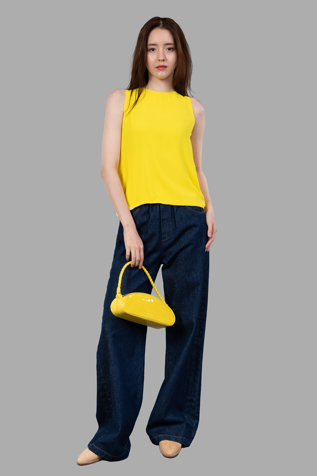 MSGM Color-block Top in yellow, front view on model, sleeveless with relaxed fit, paired with jeans, showcasing freedom.