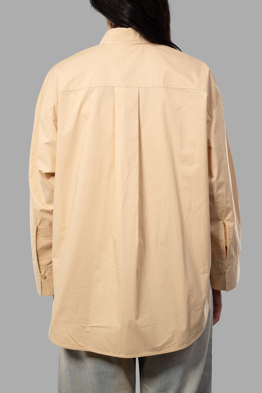 By Malene Birger Derris Organic Cotton Shirt, beige, showcasing the back with a relaxed fit and adjustable cuffs detail.