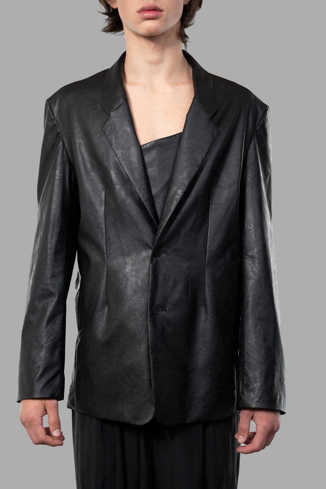 Vein Synthetic Leather Jacket shown in black, front view on model, featuring soft texture and stylish tailored design.