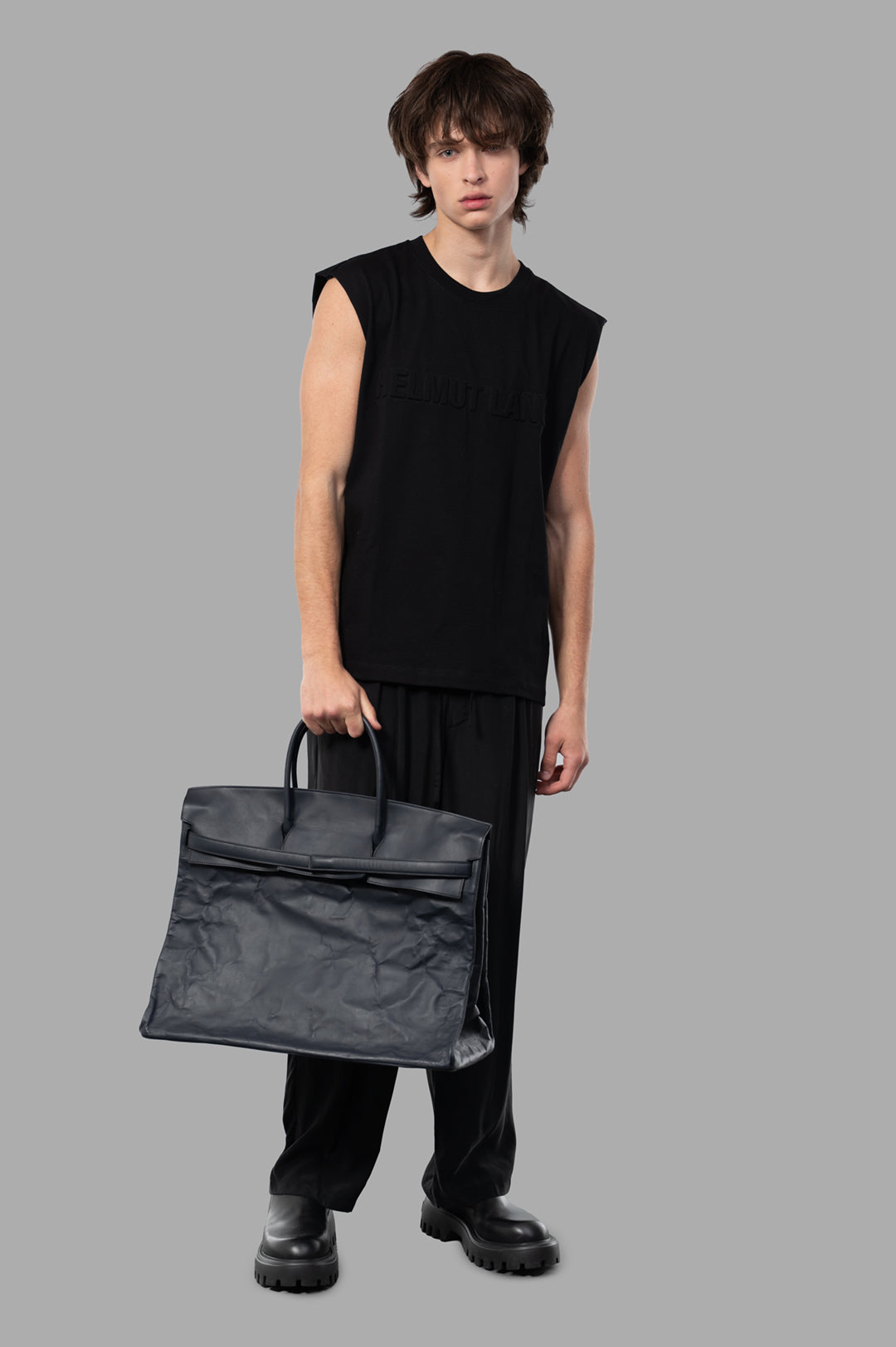 Helmut Lang Embossed Logo Tank in black, on-model front view, featuring a relaxed fit and crewneck design.