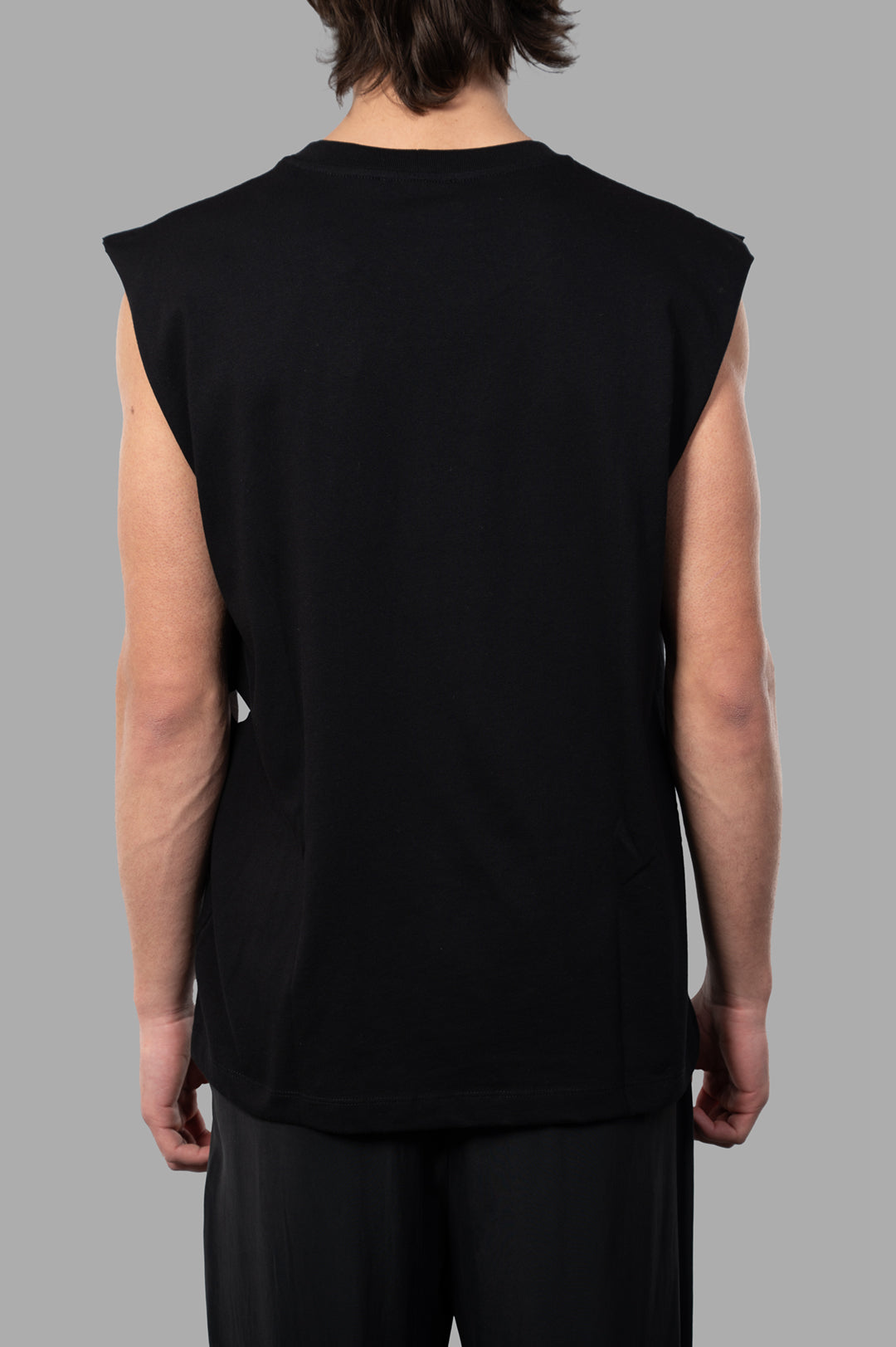 Helmut Lang Embossed Logo Tank in black, relaxed fit, showcasing crewneck and embossed logo, viewed from the back.