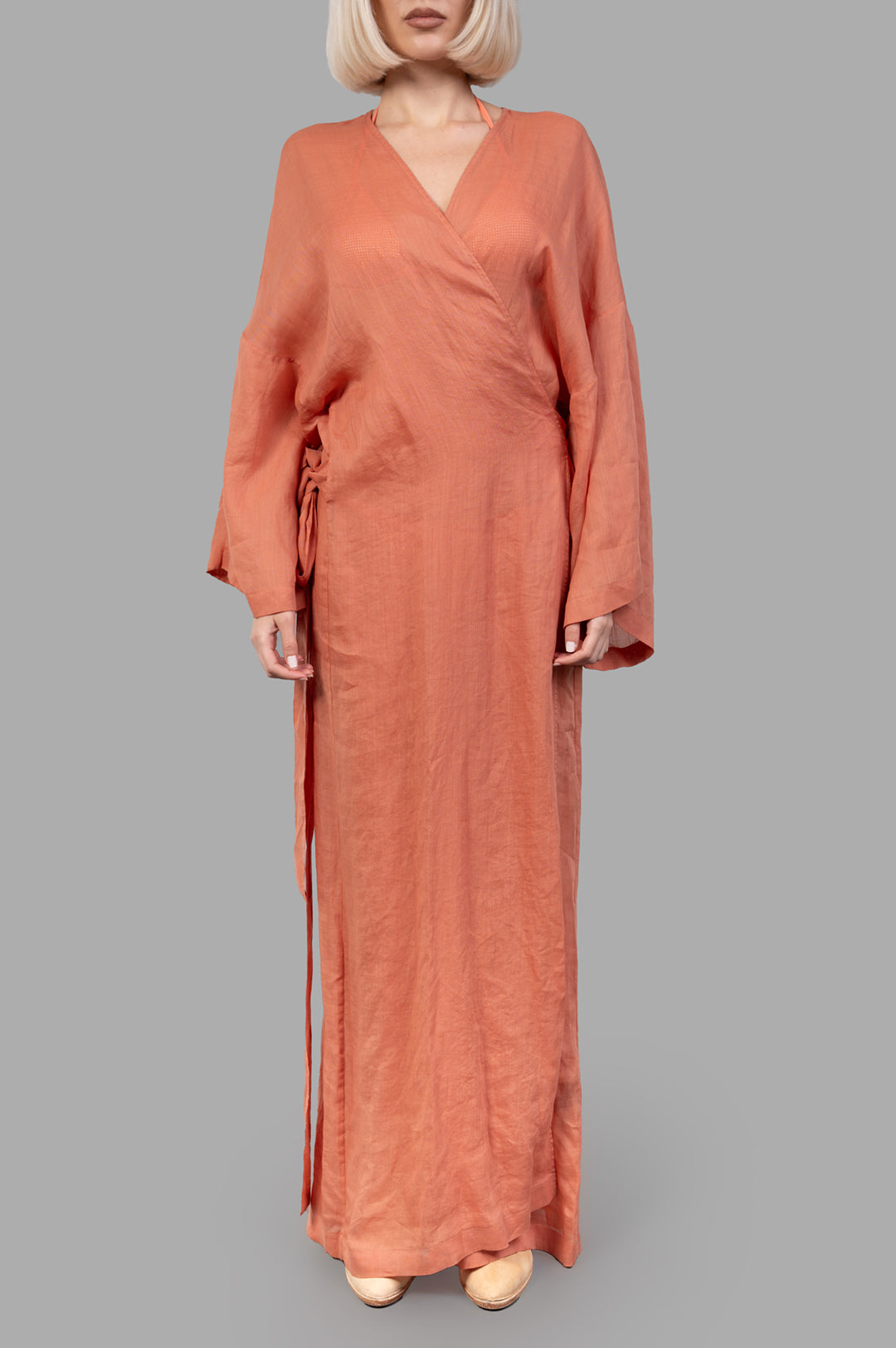 Fisico. Pink Kimono with a Frame displayed on model, showcasing the maxi-length and elegant fabric in coral tone.