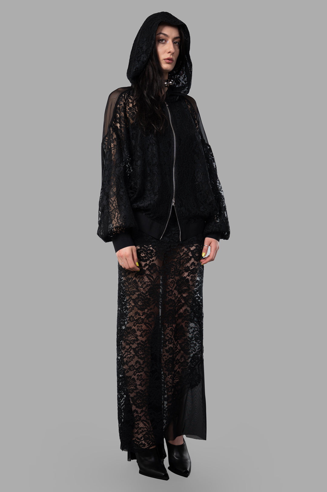 Sehnsucht Atelier black lace hoodie, front view on model, featuring oversized Victorian and steampunk design influences.