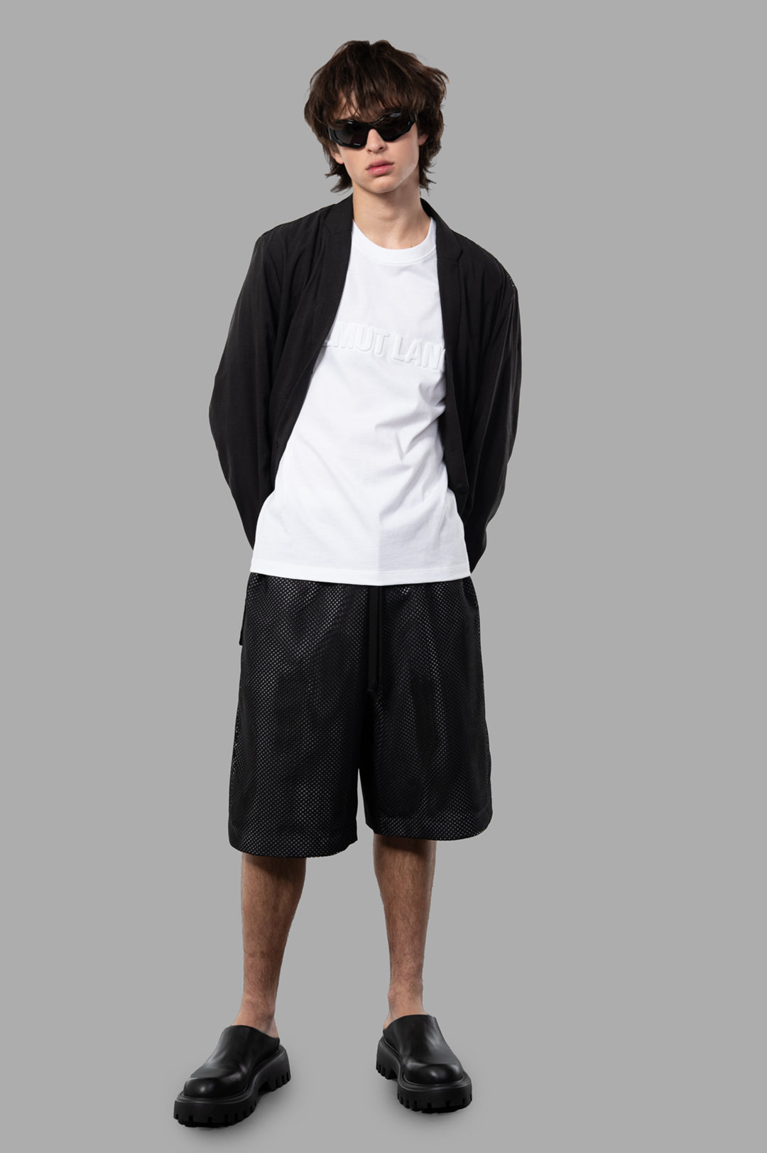 Giovanni Cavagna Semi-transparent Blazer on model, front view, showcasing black silk blend with elegant detailing.