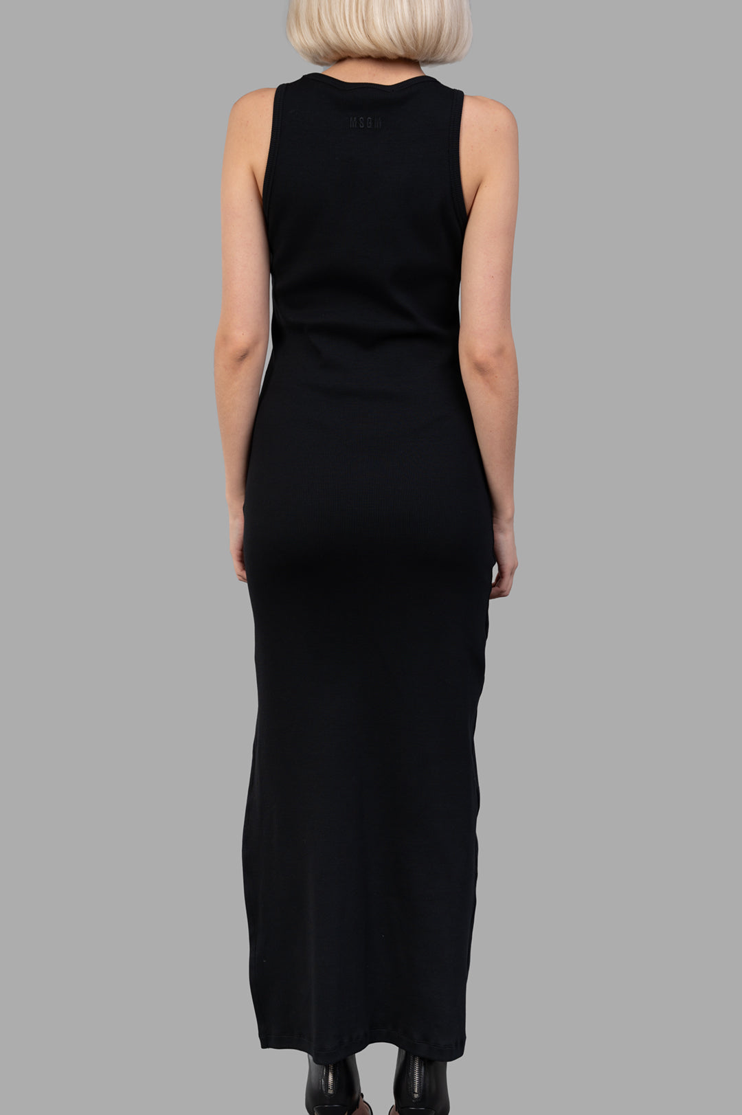 MSGM Disc-embellished Dress showcased from the back, revealing a sleek black silhouette and elegant maxi length.