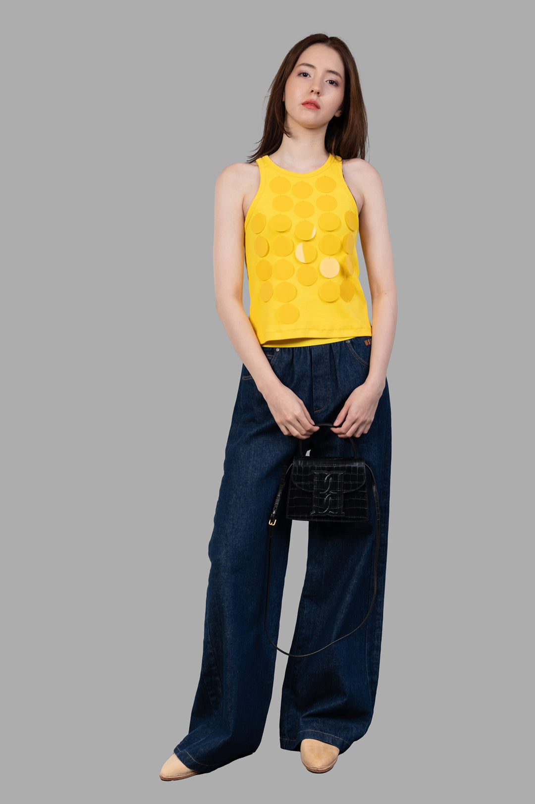 MSGM yellow Disc-embellished Tank Top on model, front view, featuring light-catching discs and flattering fit.