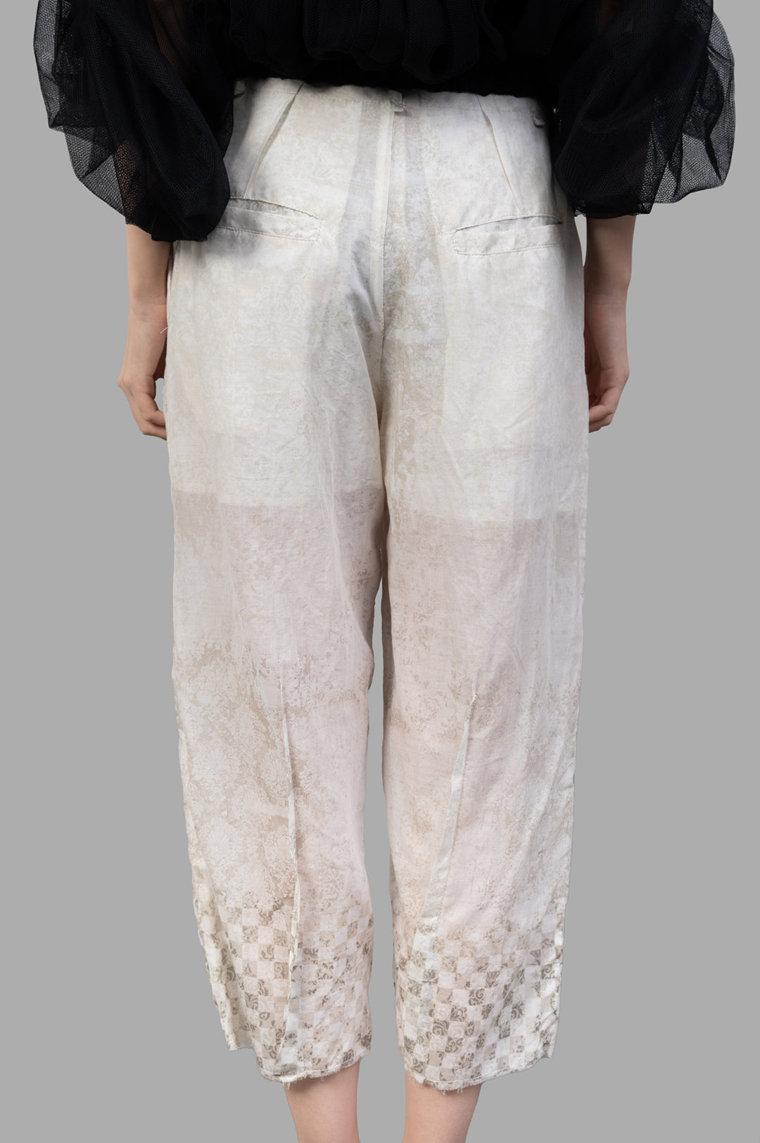 Masnada Cropped Trousers in ecru, showcasing a textured graphic design, elevated waistline, and straight-cut silhouette.