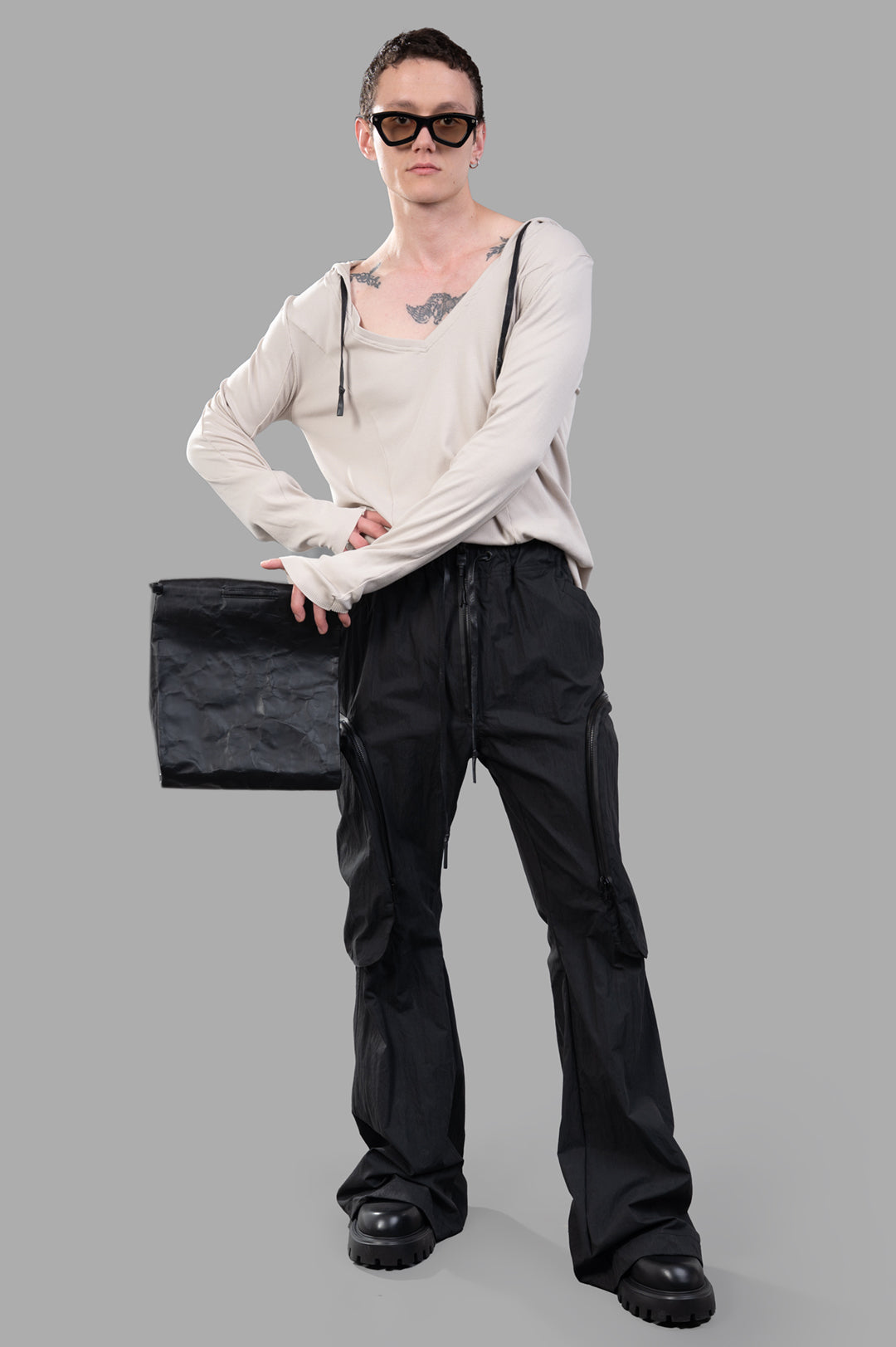 Justin Gall Cargo Trousers, on-model front view with black design, showcasing pockets and casual fit. Image 1.