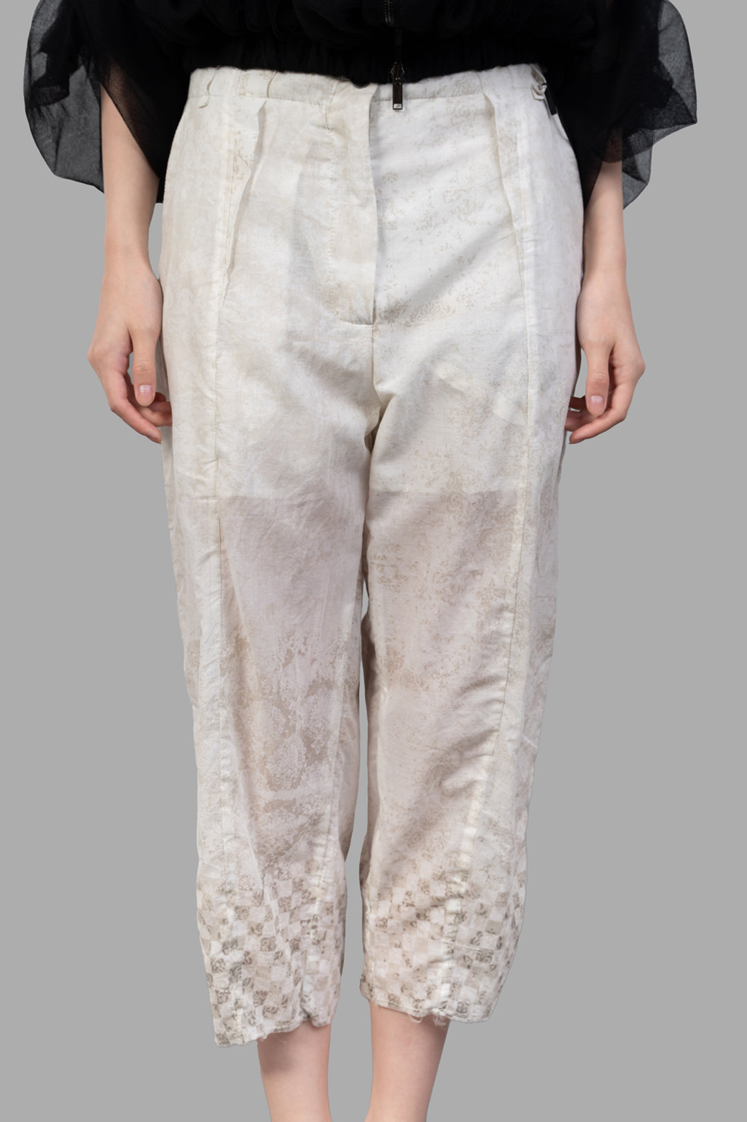 **Masnada Cropped Trousers with unique graphic detail and elevated waist, seen from the front on a model.**