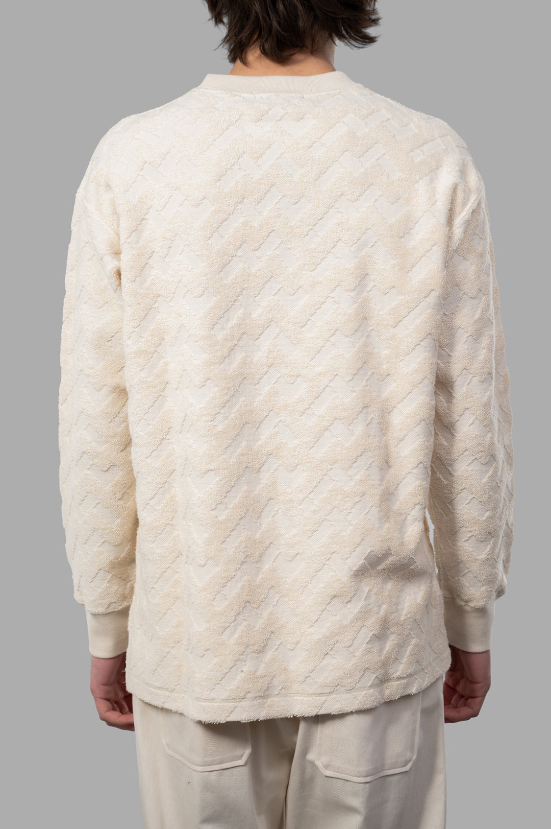 Comme des Garçons Terrycloth Sweater, ecru back view showcasing soft texture and chic zigzag pattern, crafted from 100%.